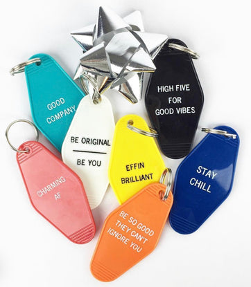 A hotel-motel keychain with feel good mantras perfect for your next gift!